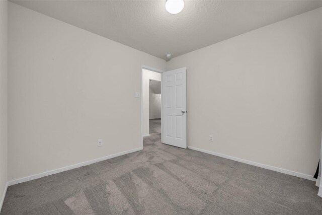 18423 Grove Brook Ln, Cypress, TX 77429 - empty room with carpet flooring and a textured ceiling
