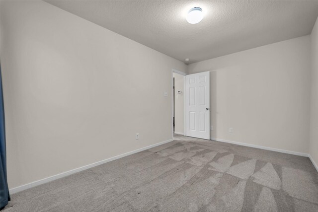 18423 Grove Brook Ln, Cypress, TX 77429 - unfurnished room with a textured ceiling and carpet flooring