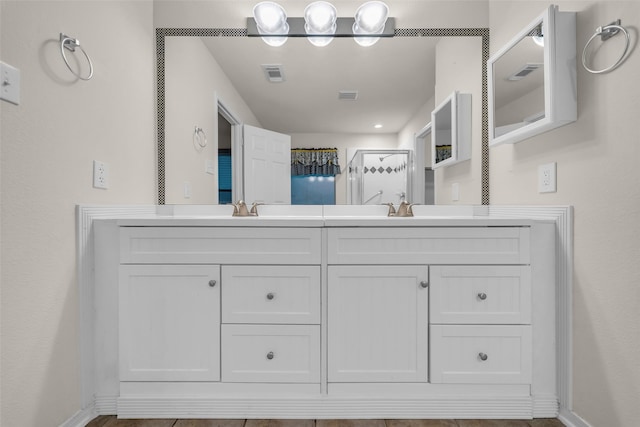 18423 Grove Brook Ln, Cypress, TX 77429 - full bathroom featuring double vanity and a shower with shower door