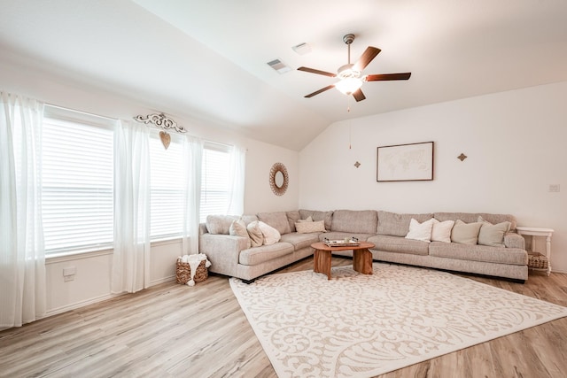 1004 Breech Dr, Crosby, TX 77532 - living area with ceiling fan, light wood-style floors, and lofted ceiling