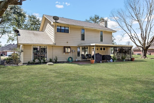 12802 Bergeron Dr, Hamshire, TX 77622 - rear view of property with a chimney, a yard, a patio area, and roof with shingles