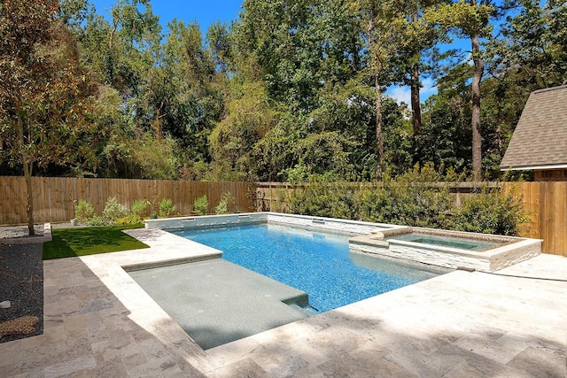 23 Shellbark, The Woodlands, TX 77382 - view of swimming pool with an in-ground hot tub, a patio area, and a fenced backyard