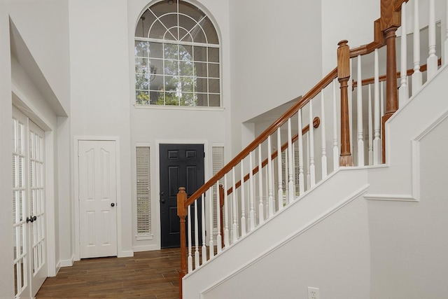 23 Shellbark, The Woodlands, TX 77382 - entryway with a towering ceiling, stairs, and wood finished floors
