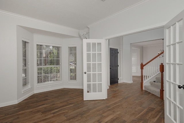 23 Shellbark, The Woodlands, TX 77382 - spare room featuring crown molding, dark wood finished floors, stairs, baseboards, and french doors
