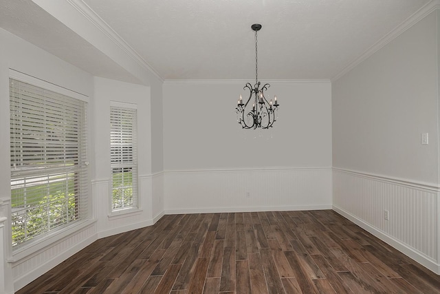 23 Shellbark, The Woodlands, TX 77382 - empty room featuring a chandelier, dark wood-style floors, wainscoting, and ornamental molding
