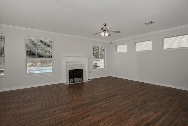 23 Shellbark, The Woodlands, TX 77382 - unfurnished living room with a ceiling fan, dark wood-style floors, a high end fireplace, ornamental molding, and baseboards