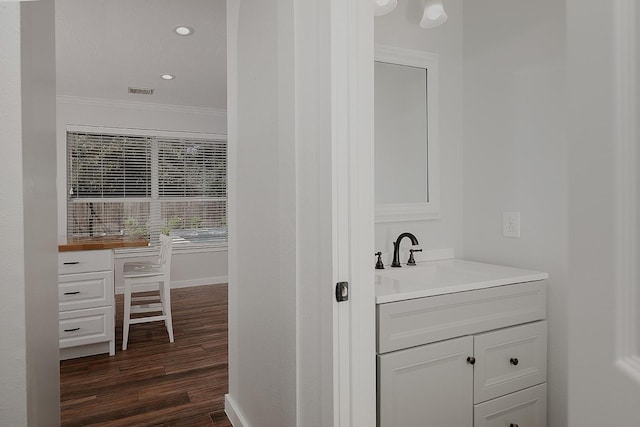 23 Shellbark, The Woodlands, TX 77382 - bathroom with crown molding, vanity, wood finished floors, baseboards, and recessed lighting