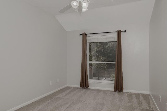 23 Shellbark, The Woodlands, TX 77382 - spare room with lofted ceiling, light colored carpet, a ceiling fan, and baseboards