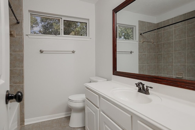 23 Shellbark, The Woodlands, TX 77382 - bathroom with vanity, toilet, a tile shower, and tile patterned flooring
