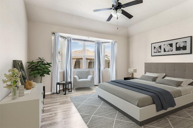 13303 Canton Cliff Ct, Humble, TX 77346 - bedroom featuring wood finished floors, a ceiling fan, and baseboards