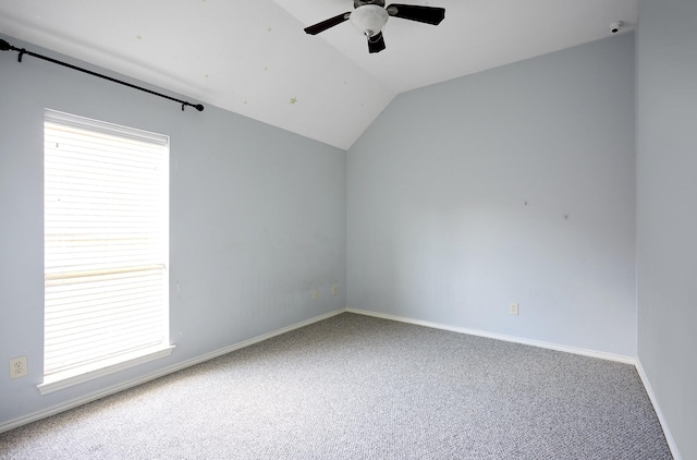 13012 Balsam Breeze Ln, Pearland, TX 77584 - empty room featuring carpet, ceiling fan, vaulted ceiling, and baseboards