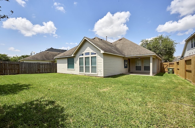 13012 Balsam Breeze Ln, Pearland, TX 77584 - back of property featuring a patio area and a shingled roof