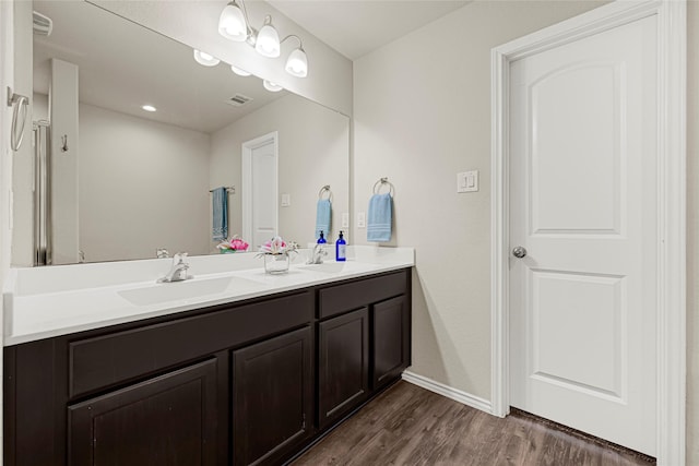 20910 Corisande St, Katy, TX 77449 - full bathroom featuring double vanity and wood finished floors