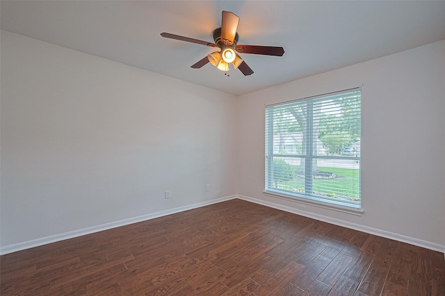 6526 Mert St, Katy, TX 77493 - spare room featuring baseboards, ceiling fan, and dark wood-style floors