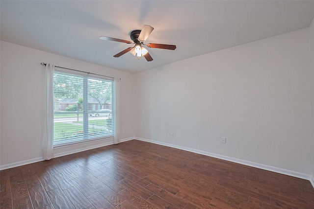 6526 Mert St, Katy, TX 77493 - spare room with dark wood-style floors, ceiling fan, and baseboards
