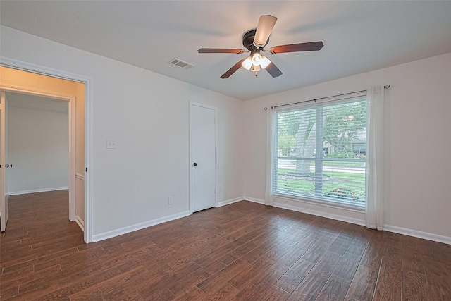 6526 Mert St, Katy, TX 77493 - spare room featuring dark wood finished floors, ceiling fan, and baseboards