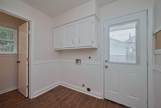 6526 Mert St, Katy, TX 77493 - washroom with hookup for an electric dryer, washer hookup, dark wood-type flooring, a wainscoted wall, and cabinet space