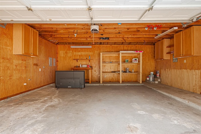 6526 Mert St, Katy, TX 77493 - garage with wood walls and a garage door opener