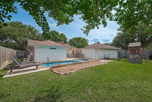 6526 Mert St, Katy, TX 77493 - rear view of house featuring a playground, a chimney, and a patio area