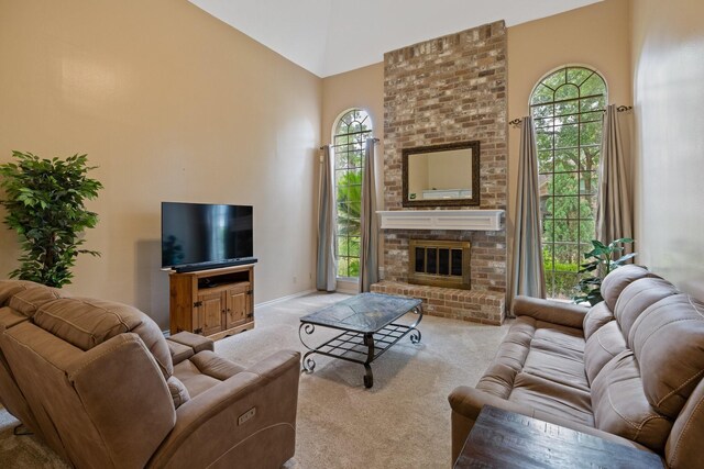 12910 Lake Mist Dr, Cypress, TX 77429 - carpeted living area with high vaulted ceiling, plenty of natural light, and a brick fireplace