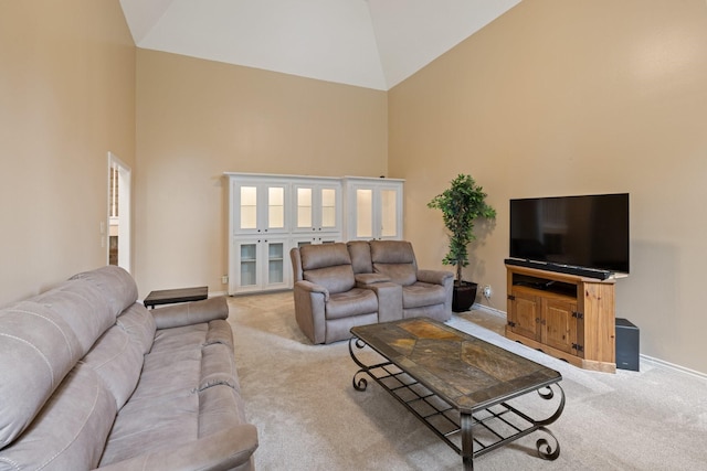 12910 Lake Mist Dr, Cypress, TX 77429 - living room featuring high vaulted ceiling, light carpet, and baseboards