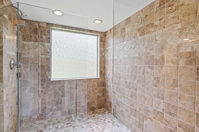 12910 Lake Mist Dr, Cypress, TX 77429 - full bathroom featuring a tile shower and recessed lighting