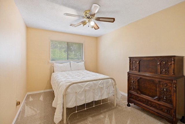 12910 Lake Mist Dr, Cypress, TX 77429 - bedroom with carpet flooring, baseboards, a textured ceiling, and ceiling fan
