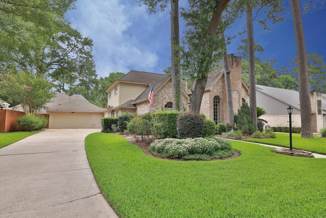 12910 Lake Mist Dr, Cypress, TX 77429 - traditional home featuring driveway, an attached garage, and brick siding