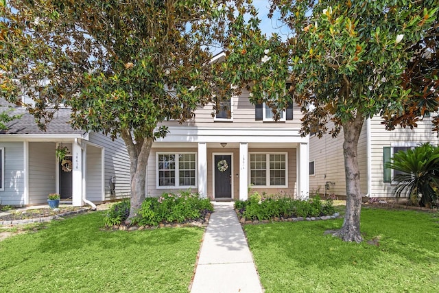 18614 Atasca Oaks Dr, Humble, TX 77346 - view of front of property featuring a front lawn and a porch