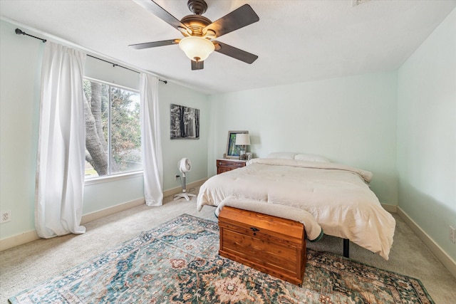 18614 Atasca Oaks Dr, Humble, TX 77346 - bedroom featuring carpet flooring, baseboards, and a ceiling fan