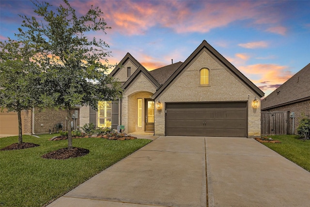 20423 Noble Arabian Dr, Tomball, TX 77377 - french country home with concrete driveway, a garage, and stone siding