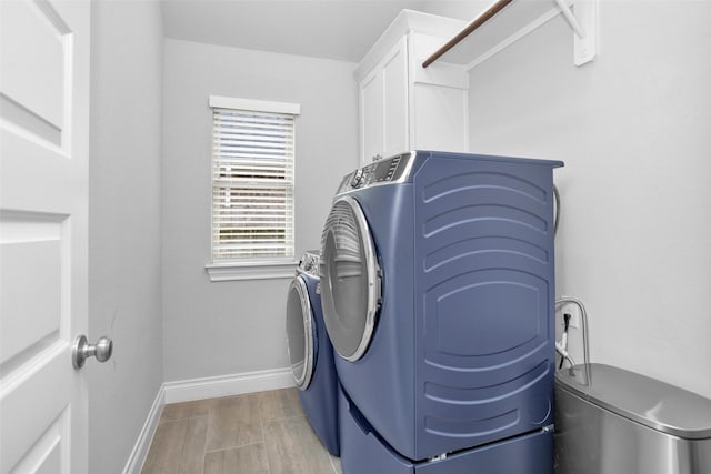 20423 Noble Arabian Dr, Tomball, TX 77377 - washroom with washer and dryer and cabinet space