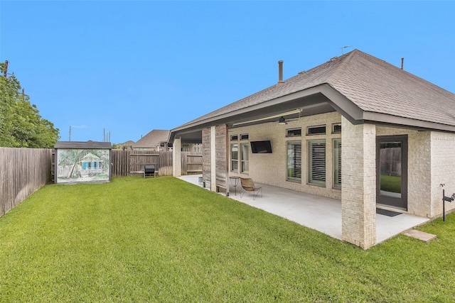 20423 Noble Arabian Dr, Tomball, TX 77377 - back of house featuring a fenced backyard, brick siding, ceiling fan, a patio area, and a shingled roof
