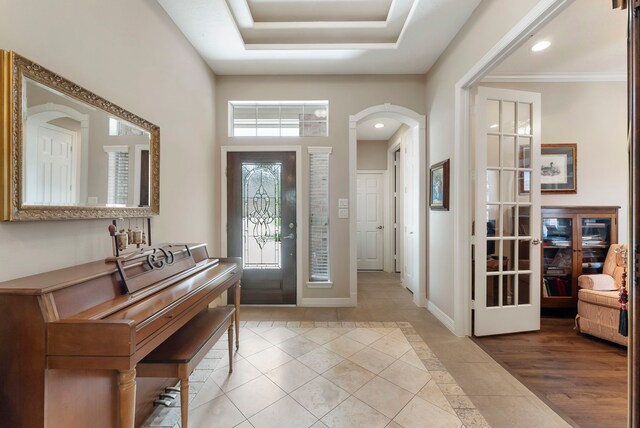 25514 Long Iron Ct, Spring, TX 77389 - entrance foyer with tile patterned floors, arched walkways, recessed lighting, and inlaid floor details