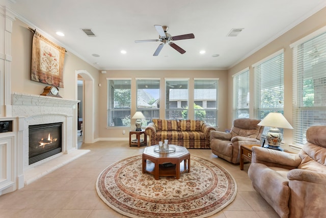 25514 Long Iron Ct, Spring, TX 77389 - living area featuring ceiling fan, light tile patterned floors, a fireplace, crown molding, and recessed lighting