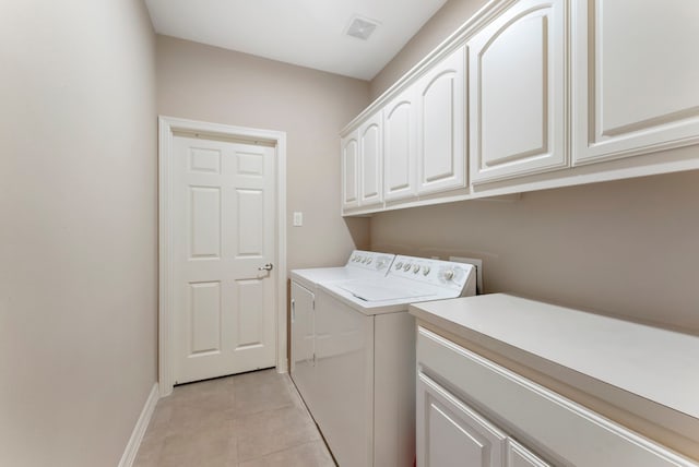25514 Long Iron Ct, Spring, TX 77389 - laundry area with cabinet space, separate washer and dryer, and light tile patterned flooring