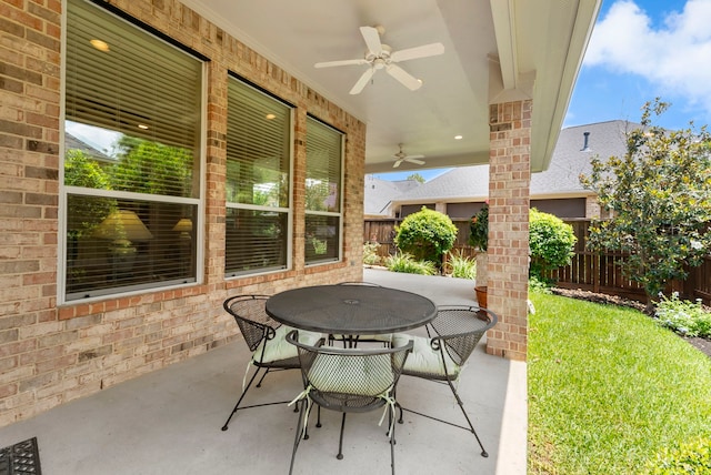 25514 Long Iron Ct, Spring, TX 77389 - fenced backyard featuring ceiling fan, outdoor dining space, and a patio
