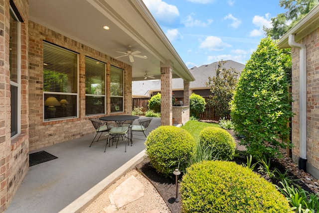 25514 Long Iron Ct, Spring, TX 77389 - fenced backyard with a ceiling fan, a patio, and outdoor dining area