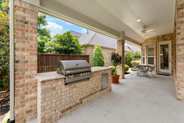 25514 Long Iron Ct, Spring, TX 77389 - view of patio / terrace with an outdoor kitchen, ceiling fan, and outdoor dining area