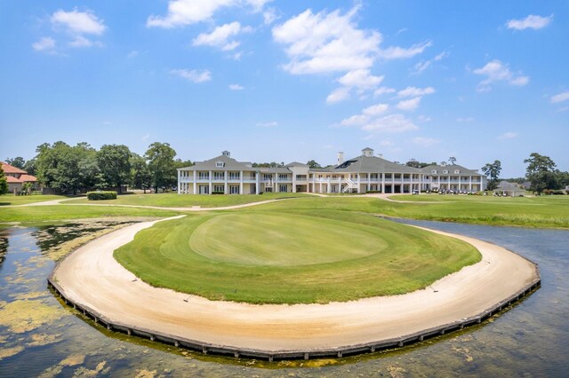25514 Long Iron Ct, Spring, TX 77389 - surrounding community with golf course view, a water view, and a yard