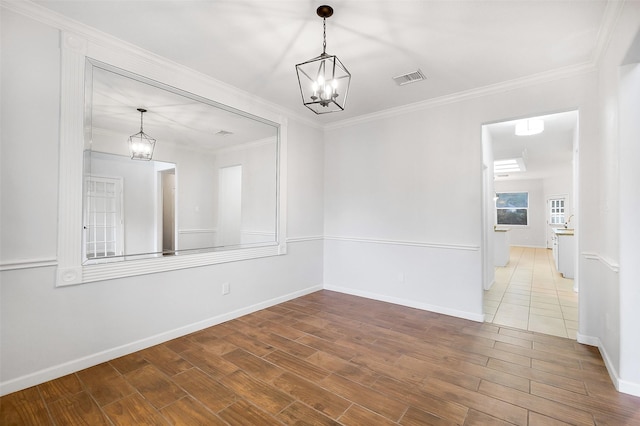 3606 Mira Glen Dr, Pearland, TX 77584 - unfurnished dining area with a chandelier, wood finished floors, baseboards, and crown molding