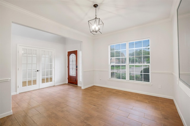 3606 Mira Glen Dr, Pearland, TX 77584 - foyer entrance with a chandelier, french doors, ornamental molding, baseboards, and wood finished floors