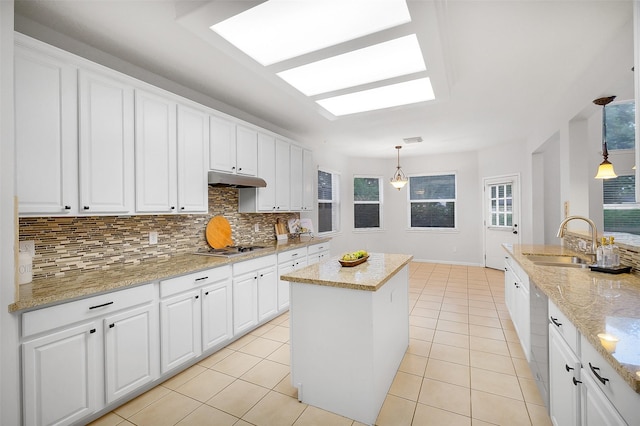 3606 Mira Glen Dr, Pearland, TX 77584 - kitchen with a sink, backsplash, and white cabinetry