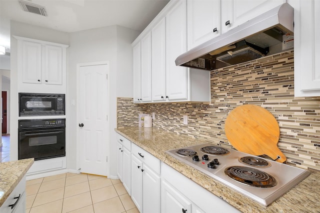 3606 Mira Glen Dr, Pearland, TX 77584 - kitchen with black appliances, under cabinet range hood, light tile patterned floors, backsplash, and white cabinetry