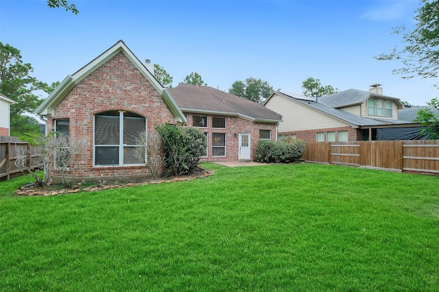 3606 Mira Glen Dr, Pearland, TX 77584 - back of property featuring brick siding and a chimney