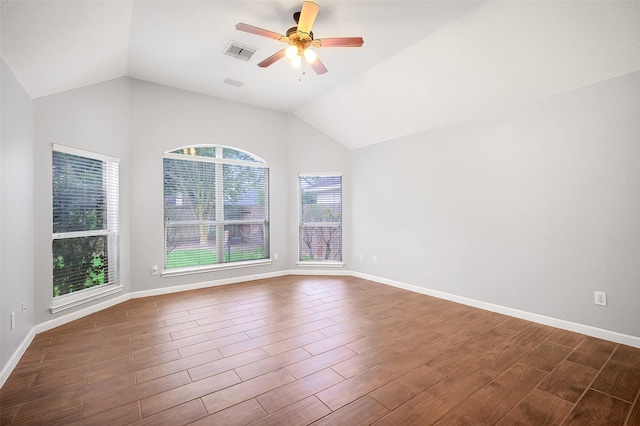 3606 Mira Glen Dr, Pearland, TX 77584 - empty room featuring vaulted ceiling, plenty of natural light, ceiling fan, dark wood-type flooring, and baseboards