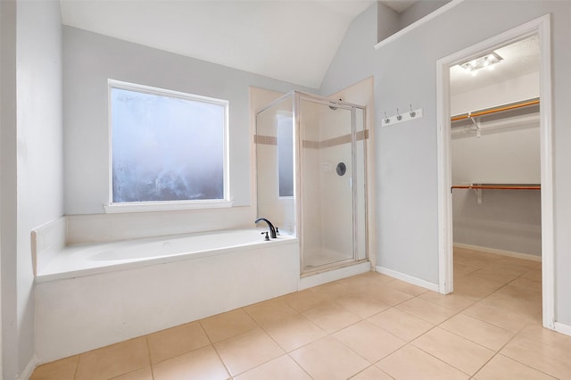 3606 Mira Glen Dr, Pearland, TX 77584 - bathroom with tile patterned flooring, a stall shower, a bath, vaulted ceiling, and a spacious closet