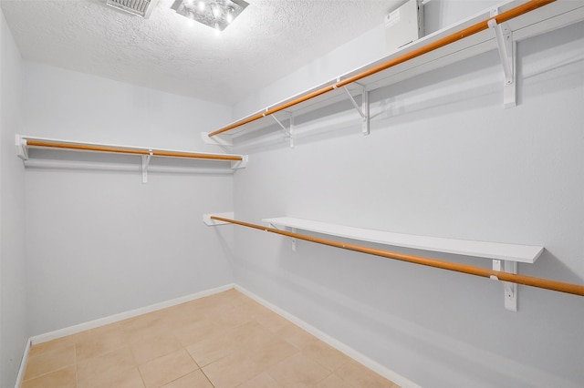 3606 Mira Glen Dr, Pearland, TX 77584 - walk in closet featuring light tile patterned floors