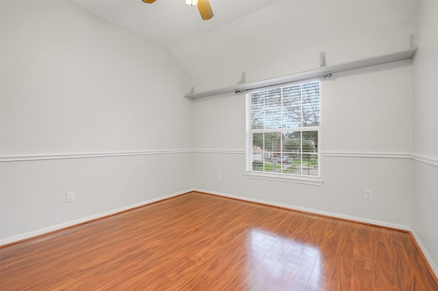 3606 Mira Glen Dr, Pearland, TX 77584 - empty room with a ceiling fan, wood finished floors, lofted ceiling, and baseboards