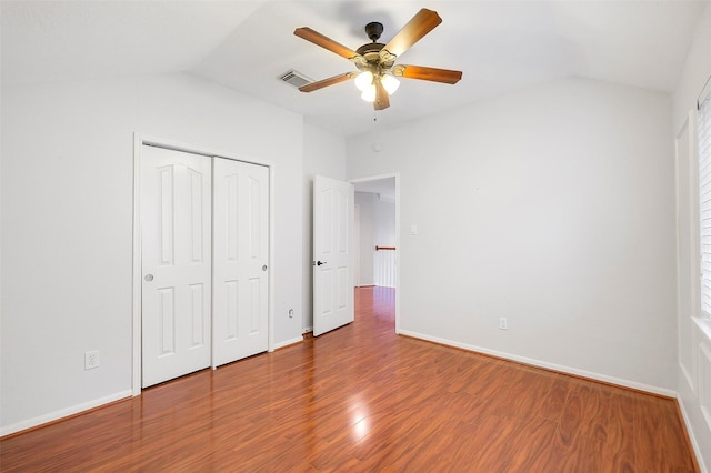 3606 Mira Glen Dr, Pearland, TX 77584 - unfurnished bedroom featuring lofted ceiling, wood finished floors, baseboards, a closet, and ceiling fan